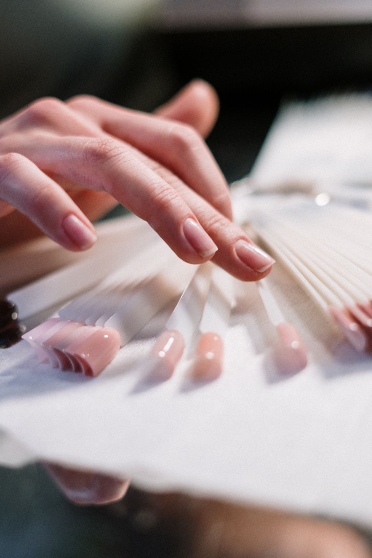 Manicure in progress at a nail atelier